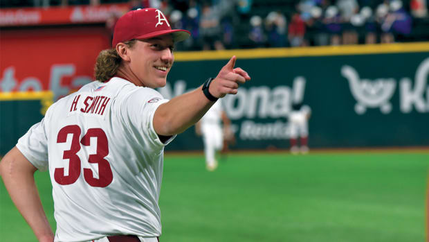 Arkansas pitcher Hagan Smith enjoys his record-setting performance against Oregon State at Globe Life Field.